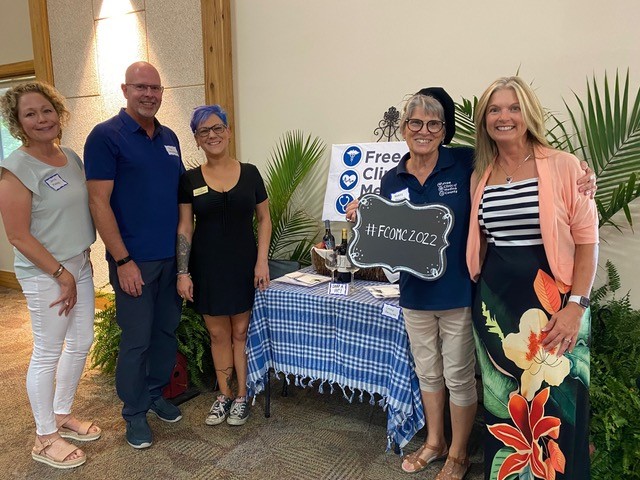 alum pose for picture